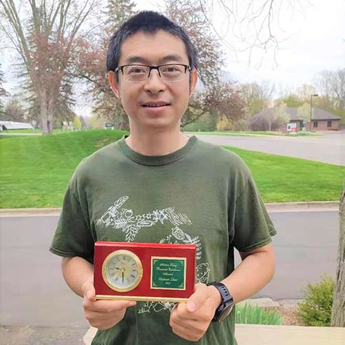 Hainan Zhao with his award clock