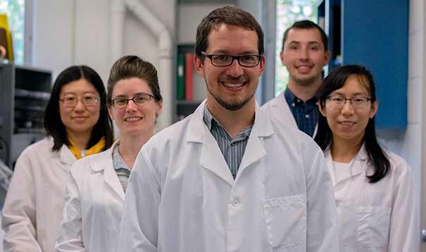 A group of people in lab coats