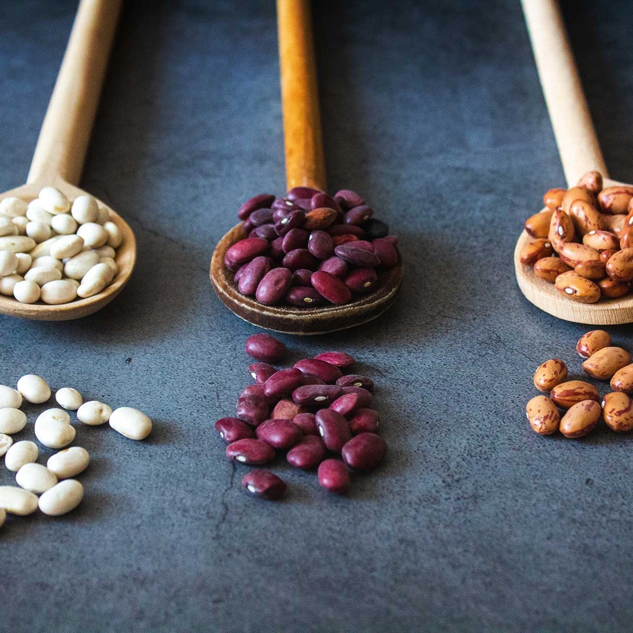 Three types of beans. White, red and brown.
