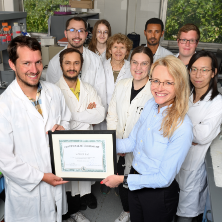 Lab members are presented with a certificate
