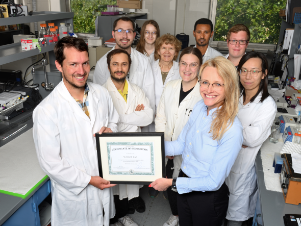 Lab members are presented with a certificate