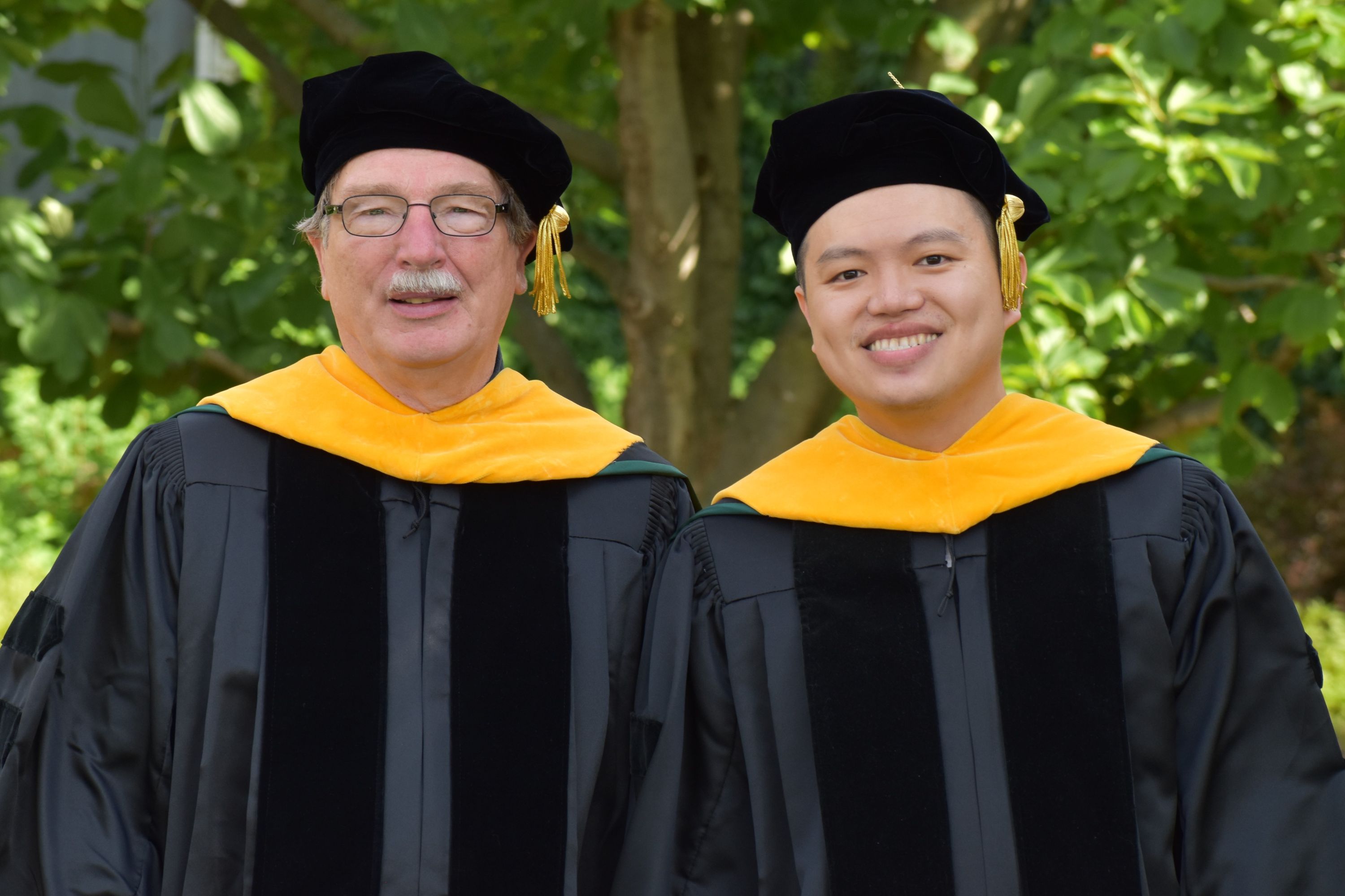 Christoph Benning and Yang-Tsung Lin in graduation robes